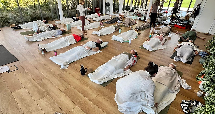Rachael Richards leading a breathwork workshop near West Sussex for health and wellbeing benefits.