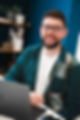 Dan Farmiloe, freelance video editor, posing for a photo in Chichester office.