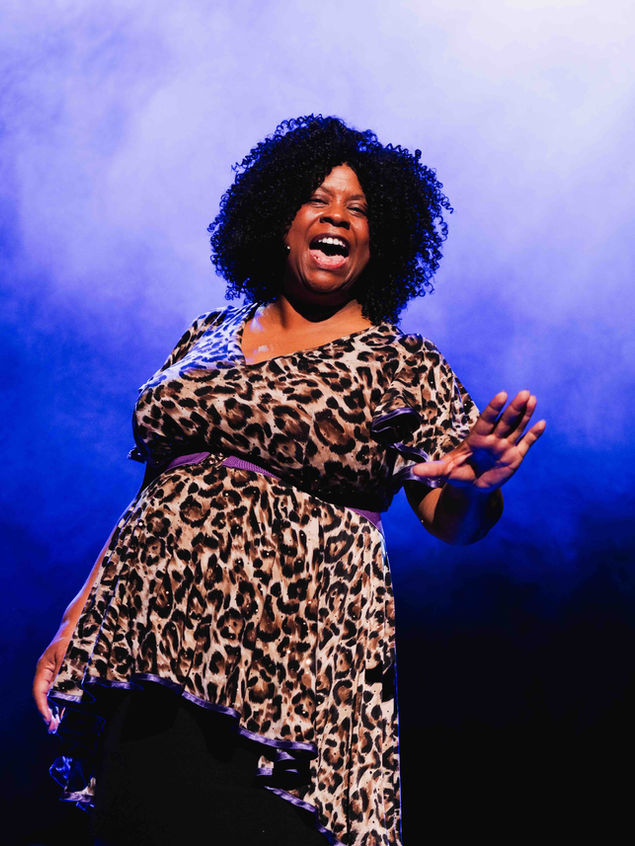 Leading actress of Sister Act Musical at Theatre Royal Portsmouth performing a musical number on stage.