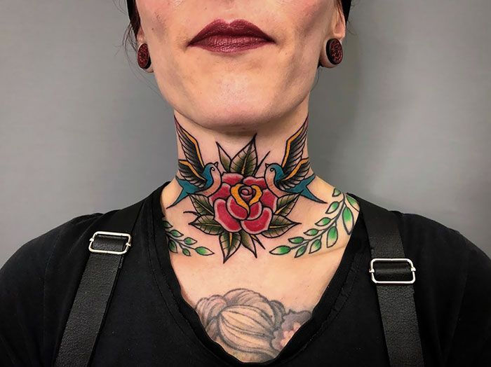 Cute cherry blossom neck tattoos for women, delicate pink petals on side neck inspiration.