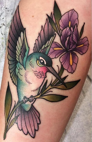  Colorful bird tattoo design on a branch