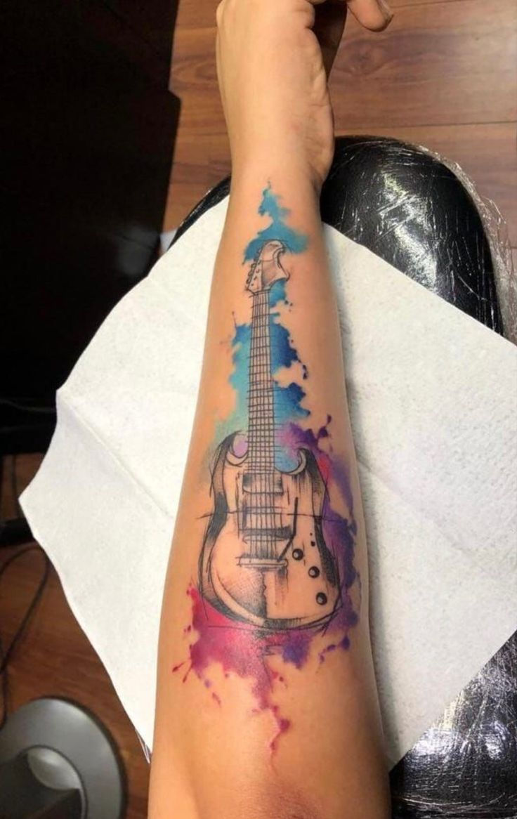 Rock and roll tattoo with skull bones design