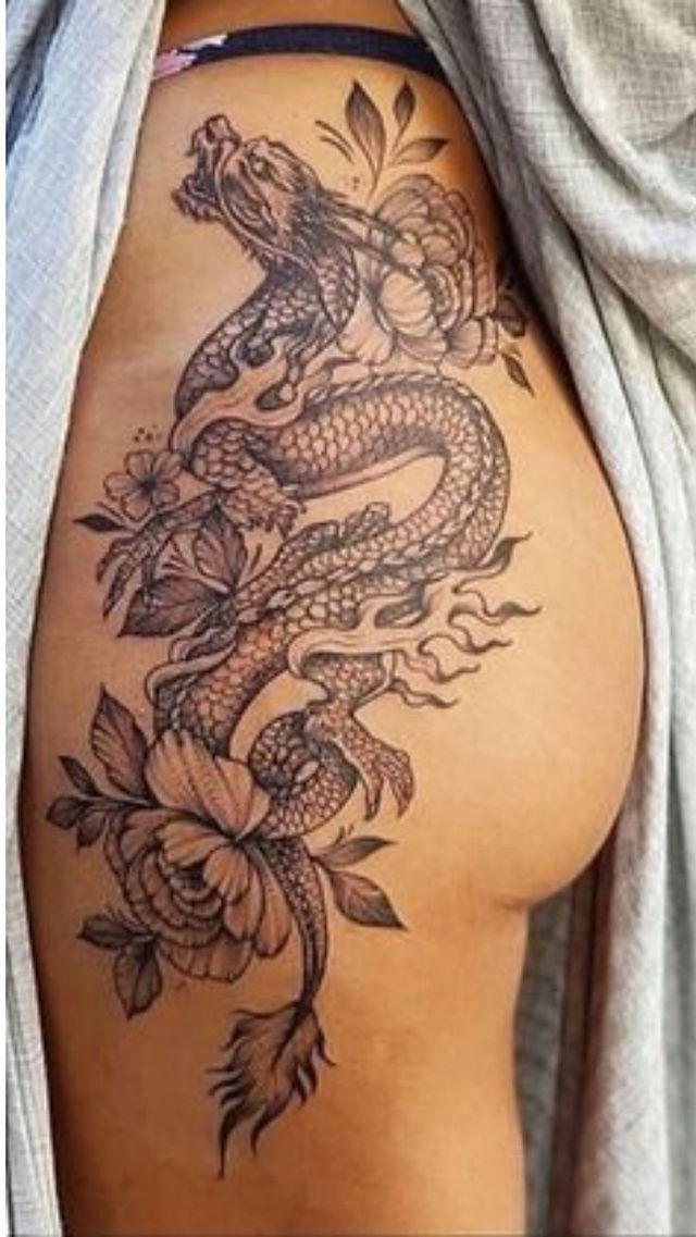 Butterfly with geometric wings hip tattoo in blackwork