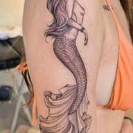 Mermaid Tattoos Explained: Siren Symbolism, Top Designs & 2026 Costs
