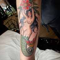 Mermaid Tattoos Explained: Siren Symbolism, Top Designs & 2026 Costs