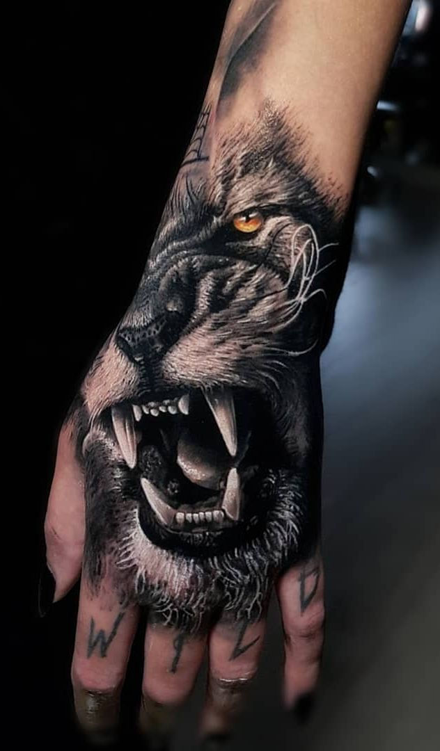 Lion tattoo with quote script lettering