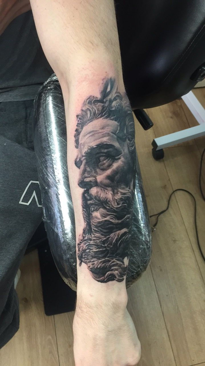 Hyper-realistic Zeus tattoo full portrait — bearded god scepter realism detailed beard calf placement