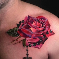 timeless rose tattoo on male chest