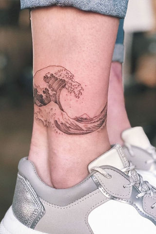 Modern geometric leg tattoo featuring sacred geometry and mandala-inspired symmetrical shapes in black and gray