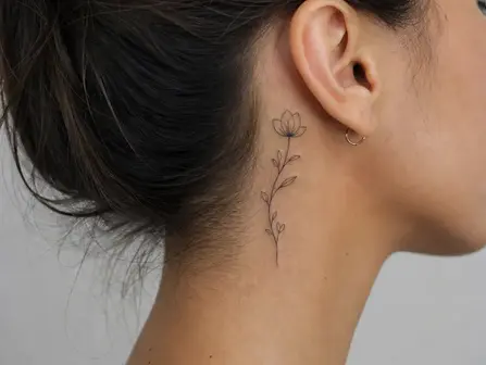 Elegant fine line neck tattoo on female nape with delicate floral motif