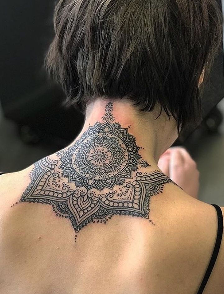 Feminine mandala dotwork neck tattoos for women, hypnotic patterns on back neck