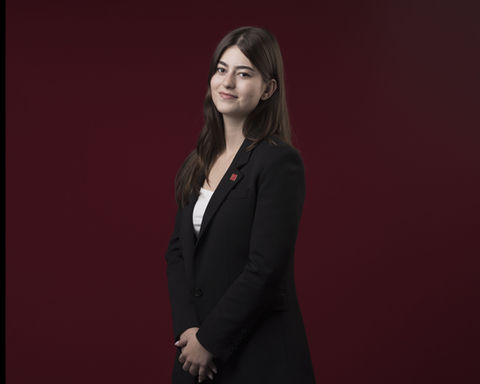 Smiling woman in black blazer