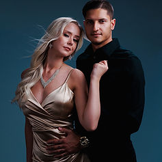 Elegant couple in formal wear, studio portrait