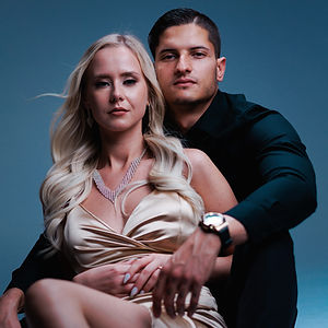 Couple in elegant attire, studio photoshoot