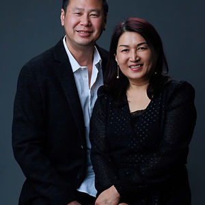 Portrait of a smiling Asian man and woman