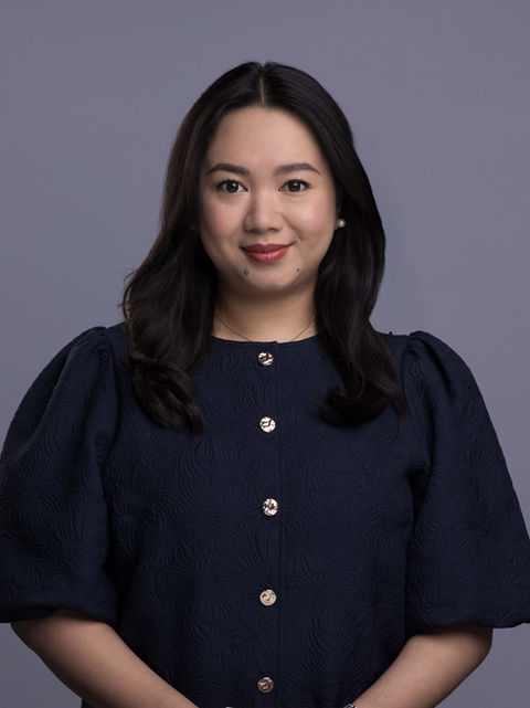 Smiling woman in dark blue top