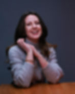 Smiling woman in gray sweater