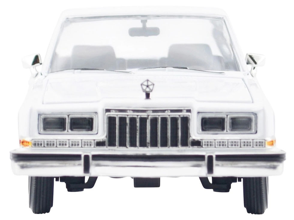 Miniatura: Front view of a white 1986 Dodge toy diecast car.