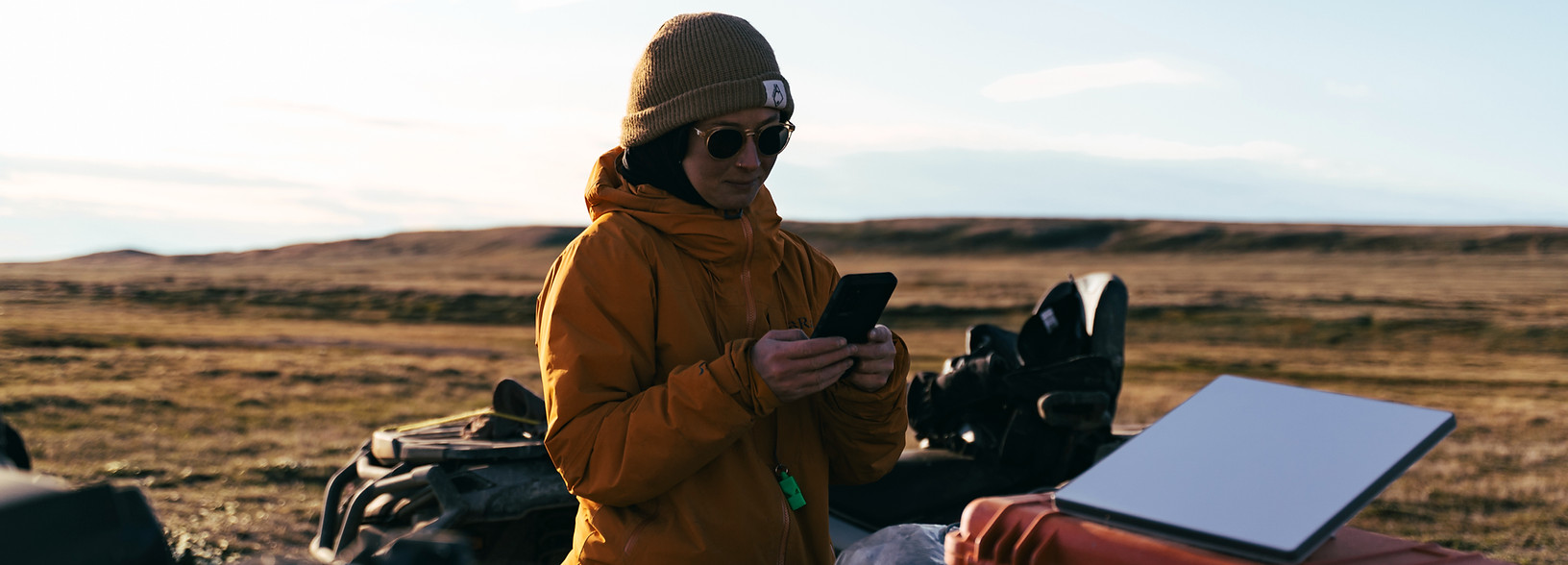 Researcher handling equipment on the tundra