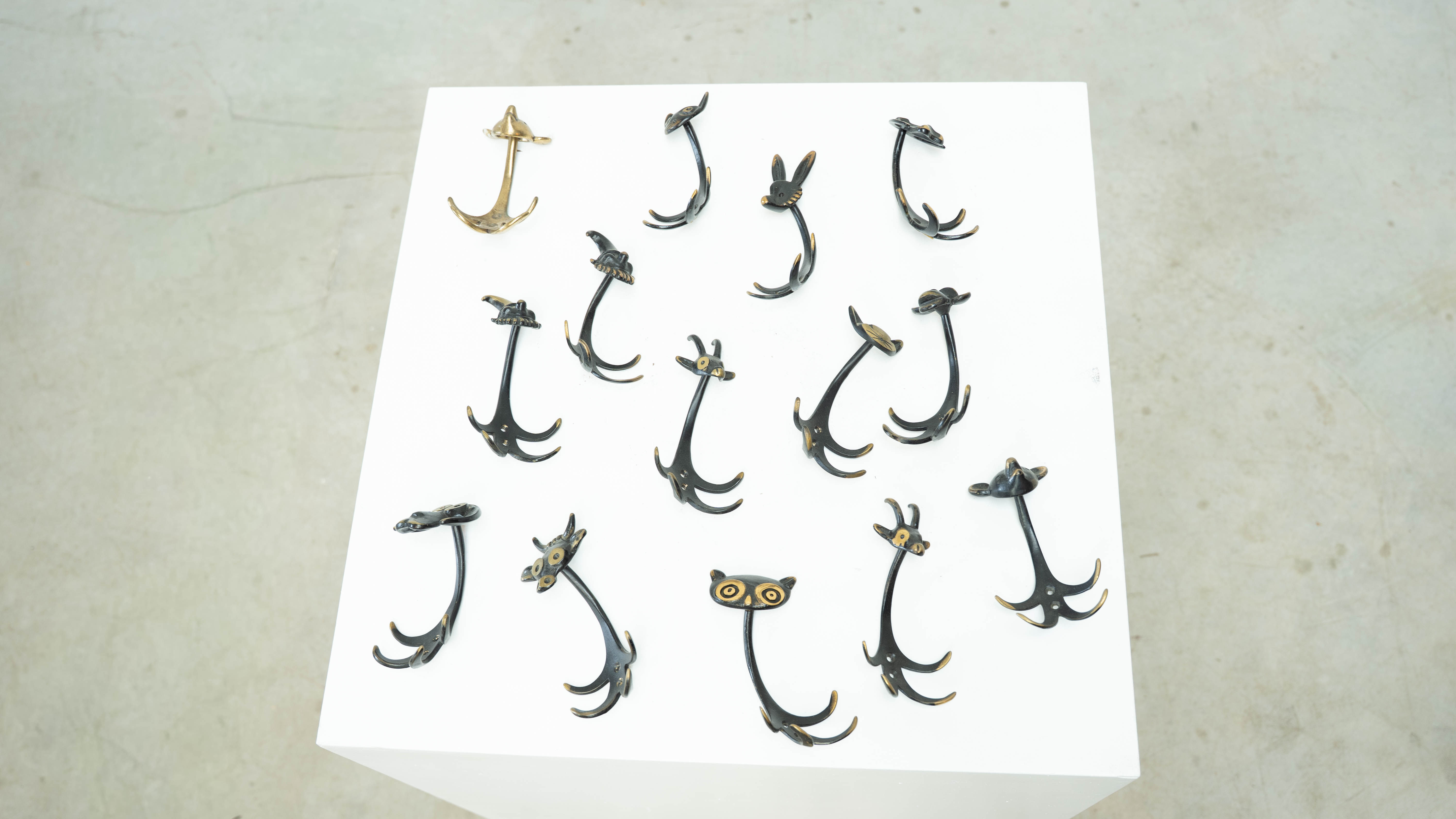 Set of 14 wall hooks by Walter Brosse