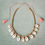 Minijatura: Cowrie sea shell necklace with pink tassels