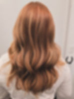 Back view of strawberry blonde hair with soft waves