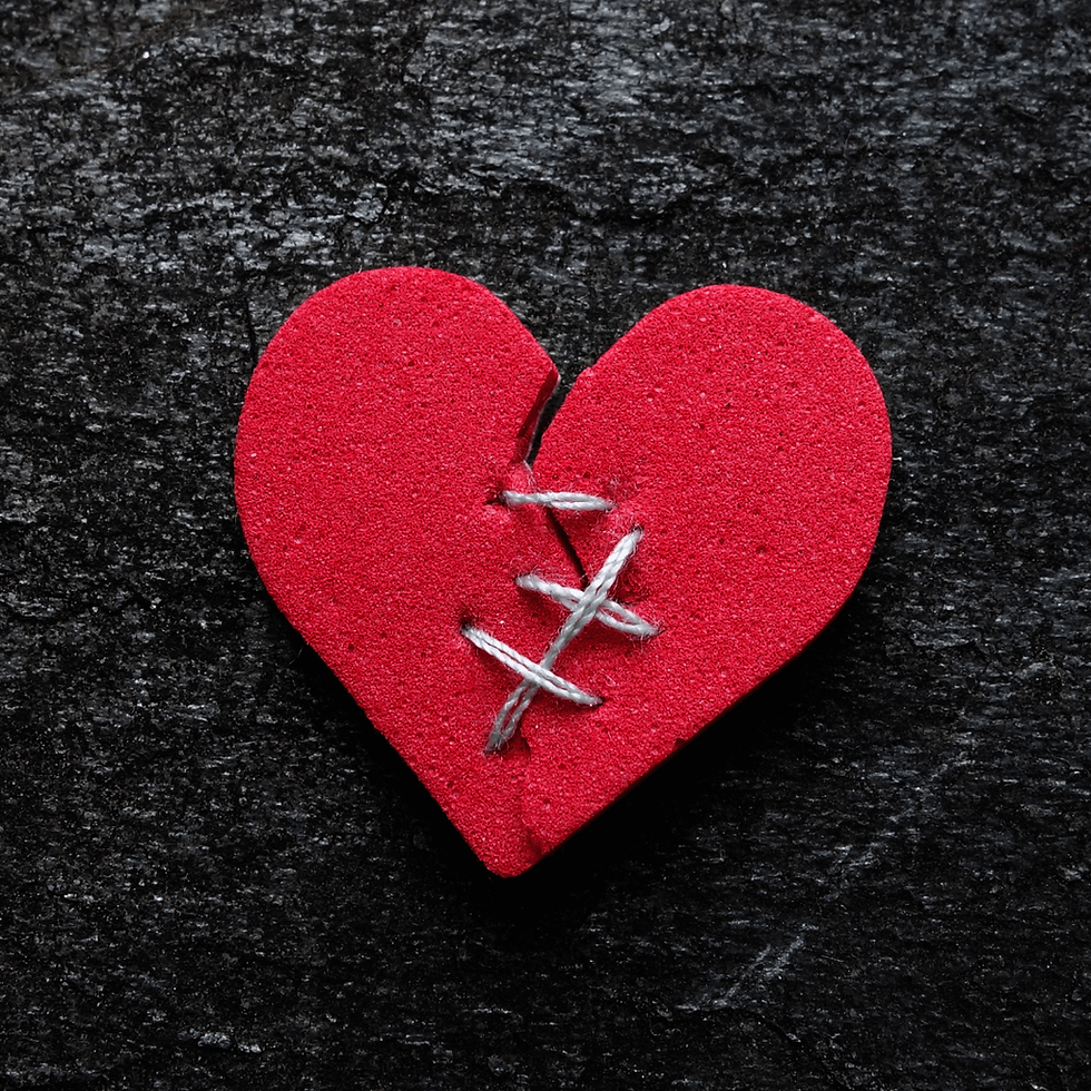 a felt heart broken with stitches