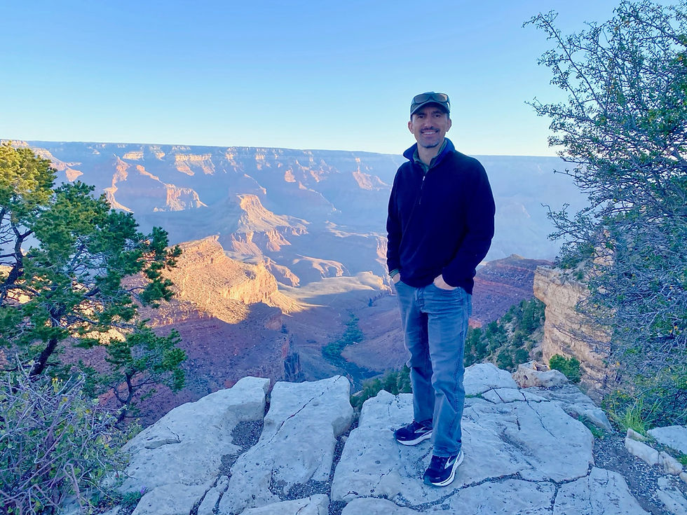 John Moore standing infront of a canyon