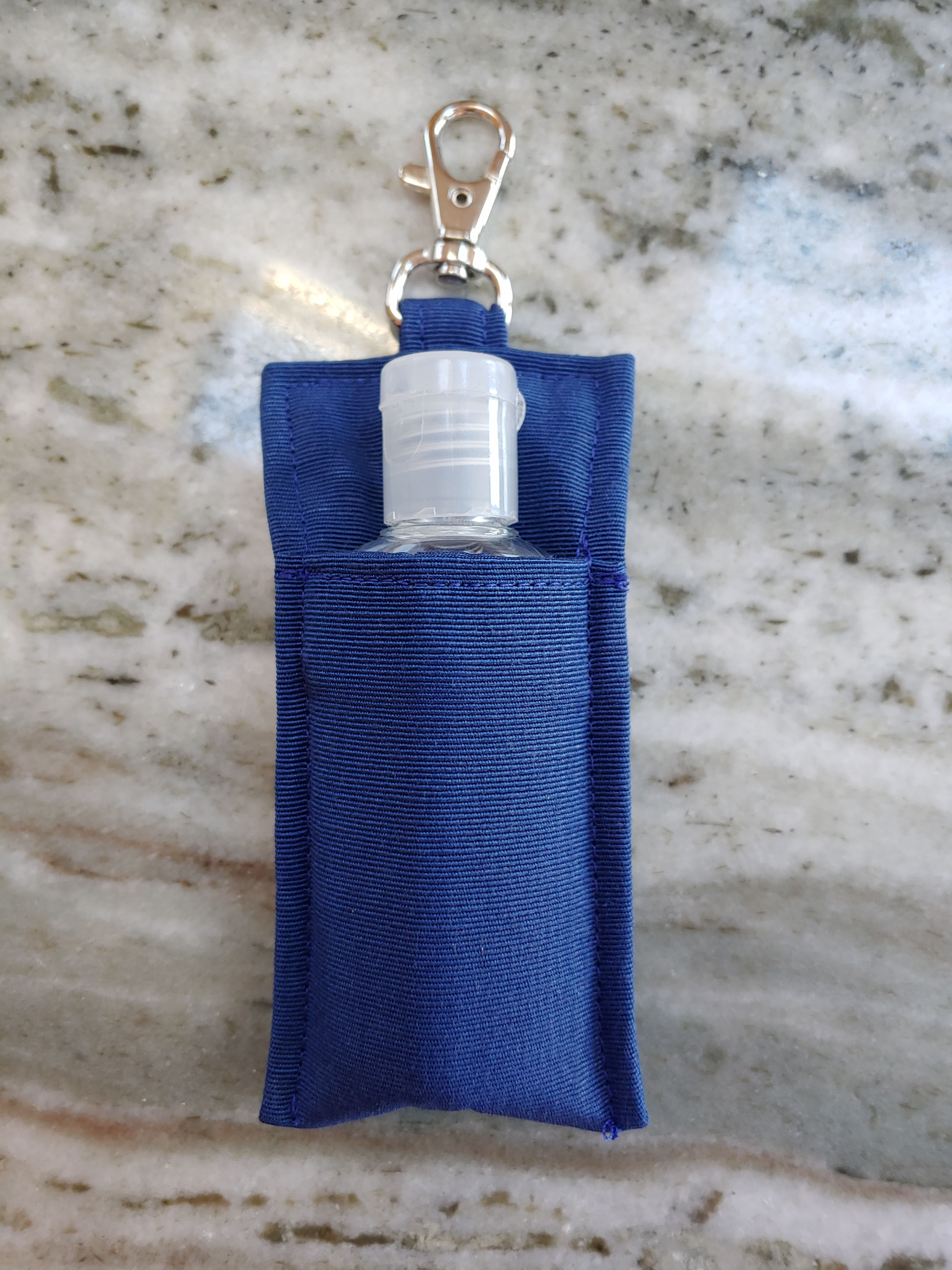 Solid blue hand sanitizer holder
