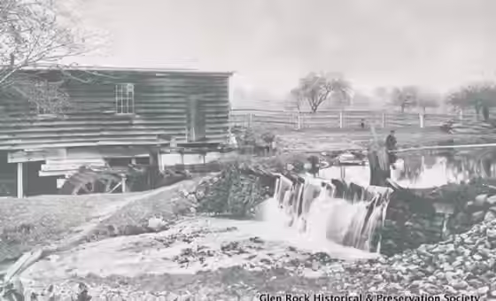 The Marinus Mill on Diamond Brook, with David Marinus (great grandson), one of the first town council members and a Civil War veteran, sitting next to the mill pond.