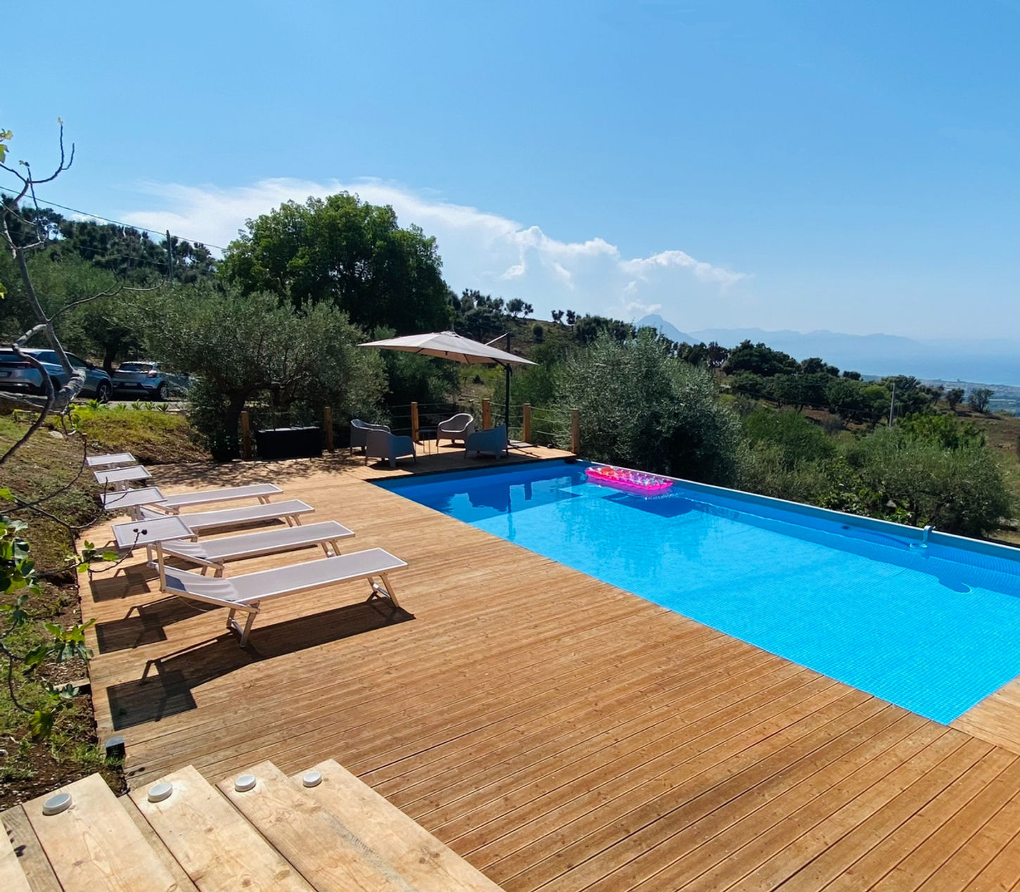 Private infinity pool with Sun terrace and panoramic sea view at Tenute Lomasi villa in Sicily