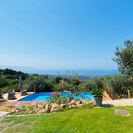 Panoramic sea view from the private garden and pool area of Tenute Lomasi villa in Sicily