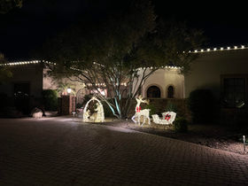 Beautiful Light and Decor Installation in Scottsdale. Warm White roofline lights make the property look quite charming