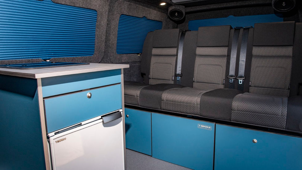 blue campervan conversion with full width RIB bed kitchen pod with fridge blue Designed to seat 3 people safely whilst travelling Vanshade's window pods