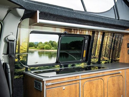 Campervan conversion Volkswagen Transporter T6 LWB vintage steel units sink hob area splashback sliding window tinted open onto lake elevating roof