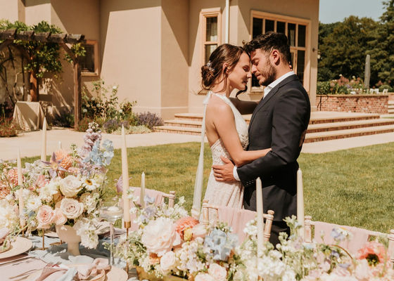 Baby pink and blue wedding tablescape with florals at Burtonfields Hall