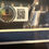Thumbnail: Beckett and JSA authentication stickers for Bill and Chase Elliott signed photos in framed display