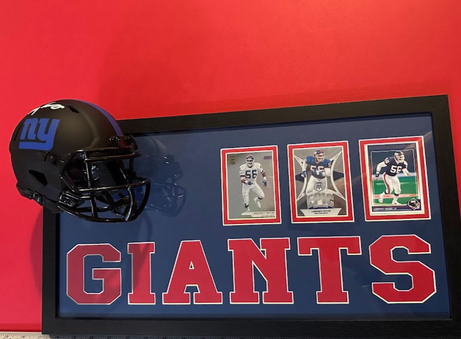 Thumbnail: Close-up of sports cards in Lawrence Taylor New York Giants framed memorabilia display