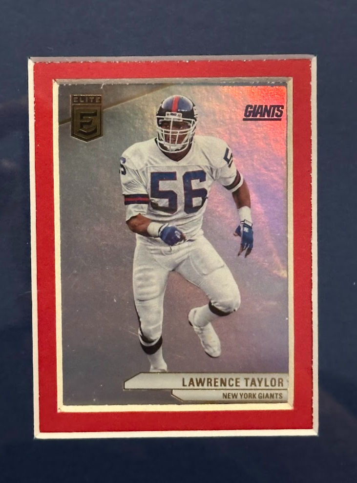 Thumbnail: Close-up of sports cards in Lawrence Taylor New York Giants framed memorabilia display