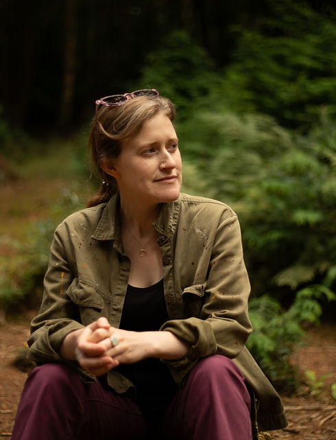 Therapist sith hands together and looking to the side with a smile (2)_edited.jpg