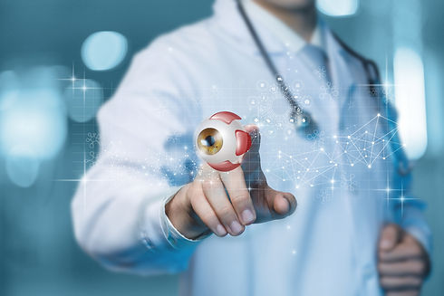 Doctor ophthalmologist clicks on a virtual computer screen on a model eye..jpg