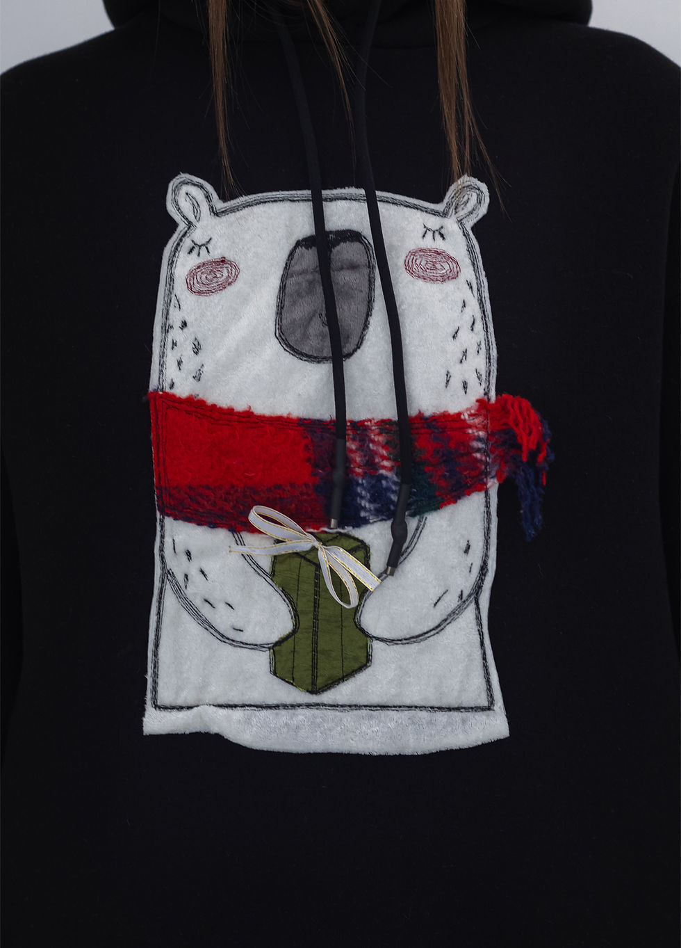 Прев'ю: Female model wearing a designer hoodie with a vibrant graphic