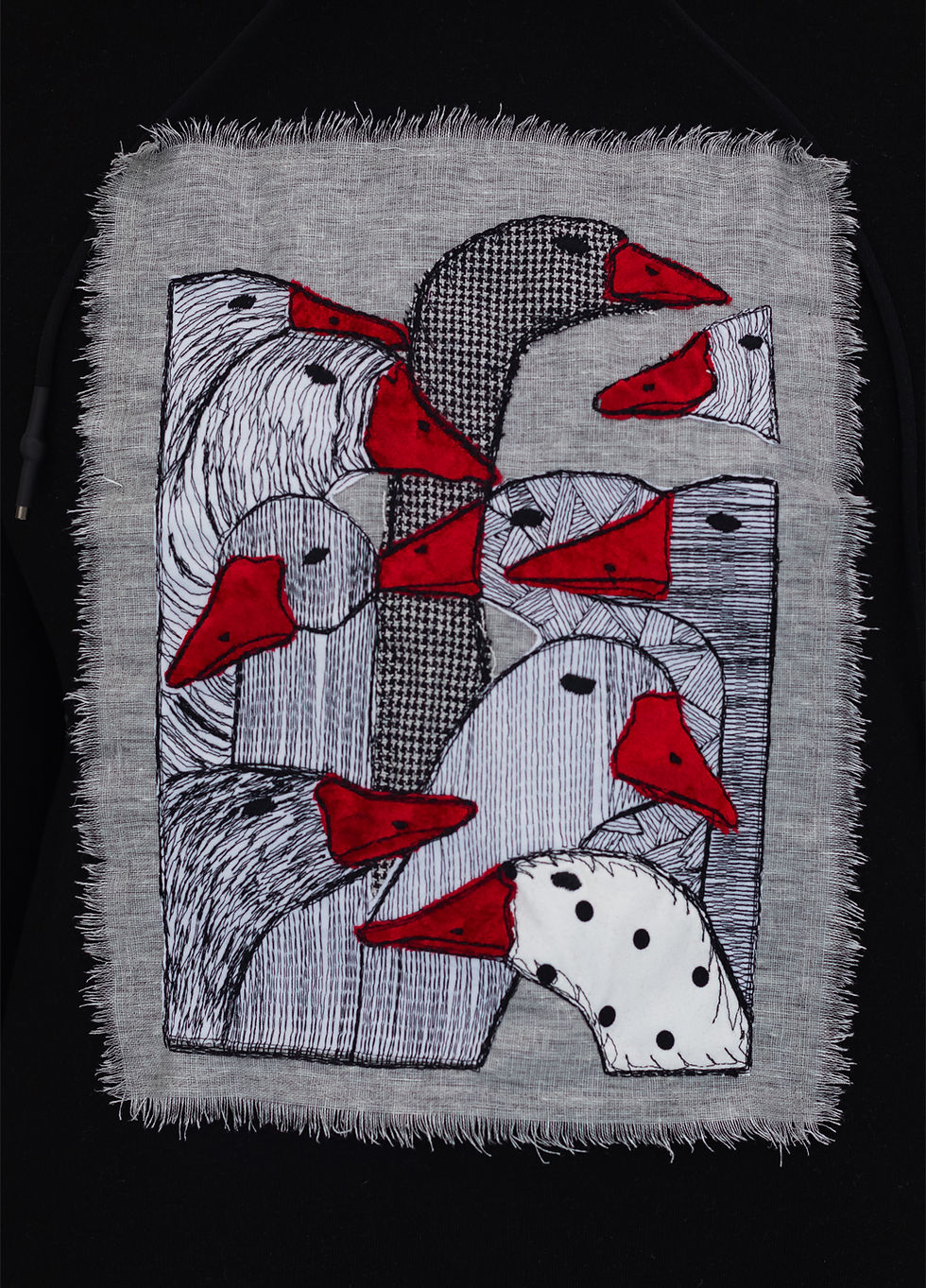 Thumbnail: Female model wearing a designer sweatshirt with a vibrant graphic.