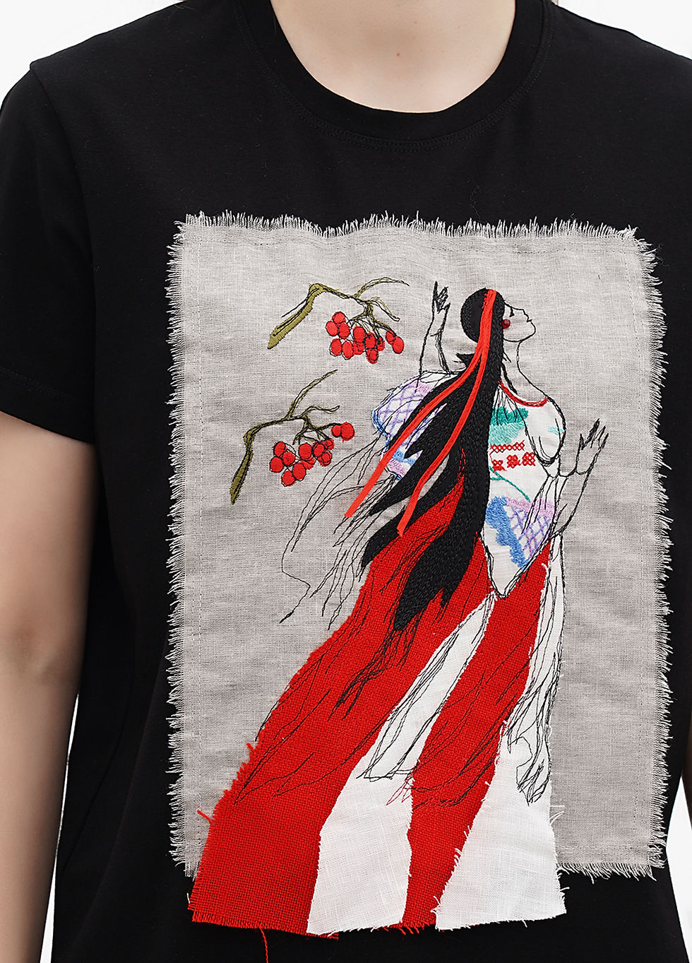 Thumbnail: Female model wearing a designer t-shirt with a vibrant graphic