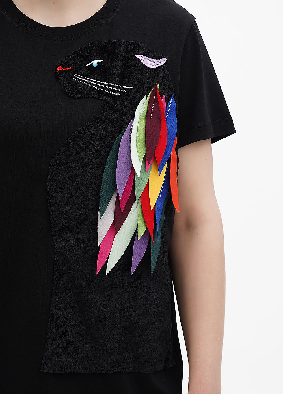 Thumbnail: Female model wearing a designer t-shirt with a vibrant graphic.
