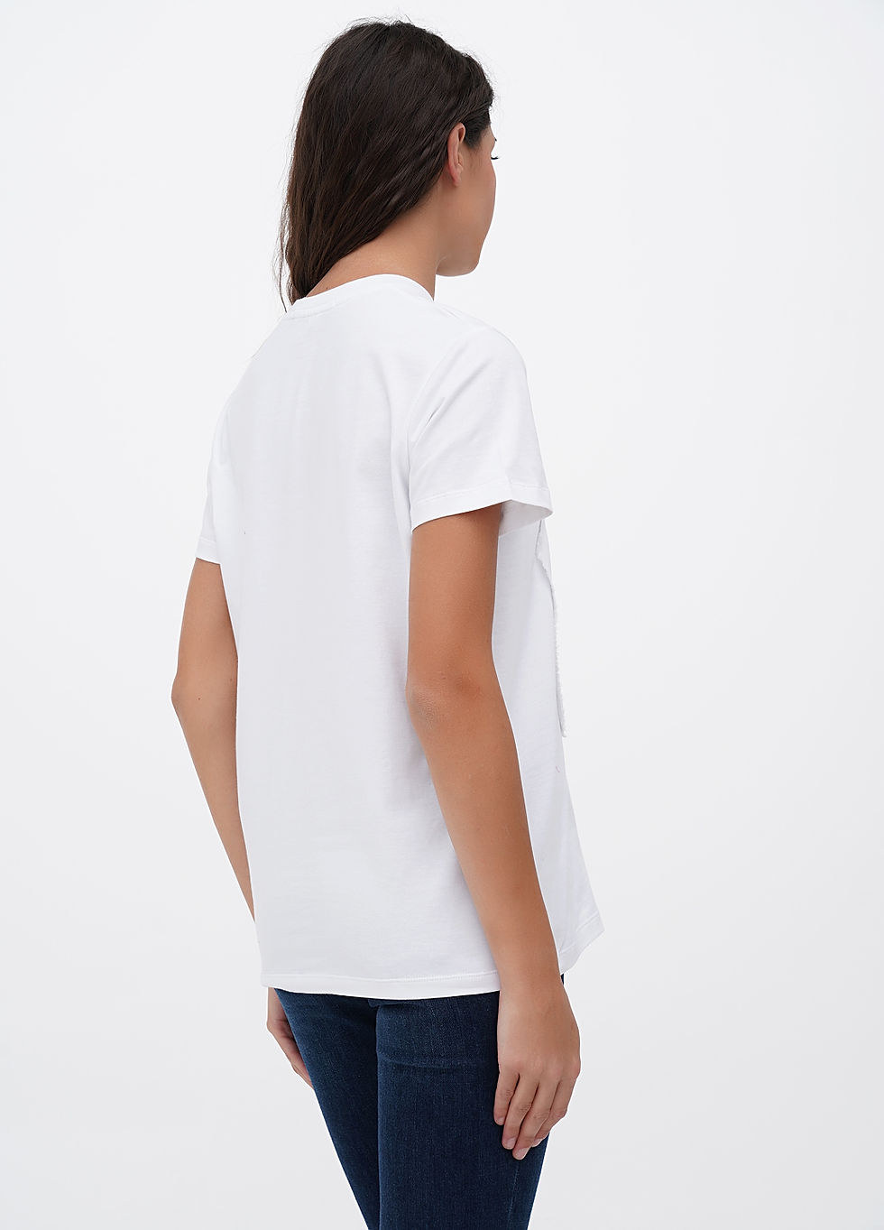 Female model wearing a designer t-shirt with a vibrant graphic.