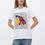 Прев'ю: Female model wearing a designer t-shirt with a vibrant graphic.
