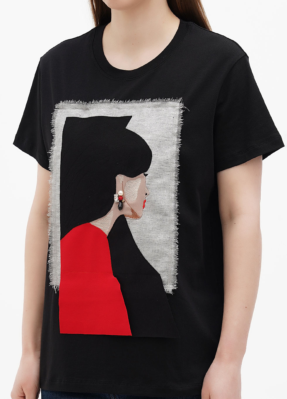 Прев'ю: Female model wearing a designer t-shirt with a vibrant graphic.