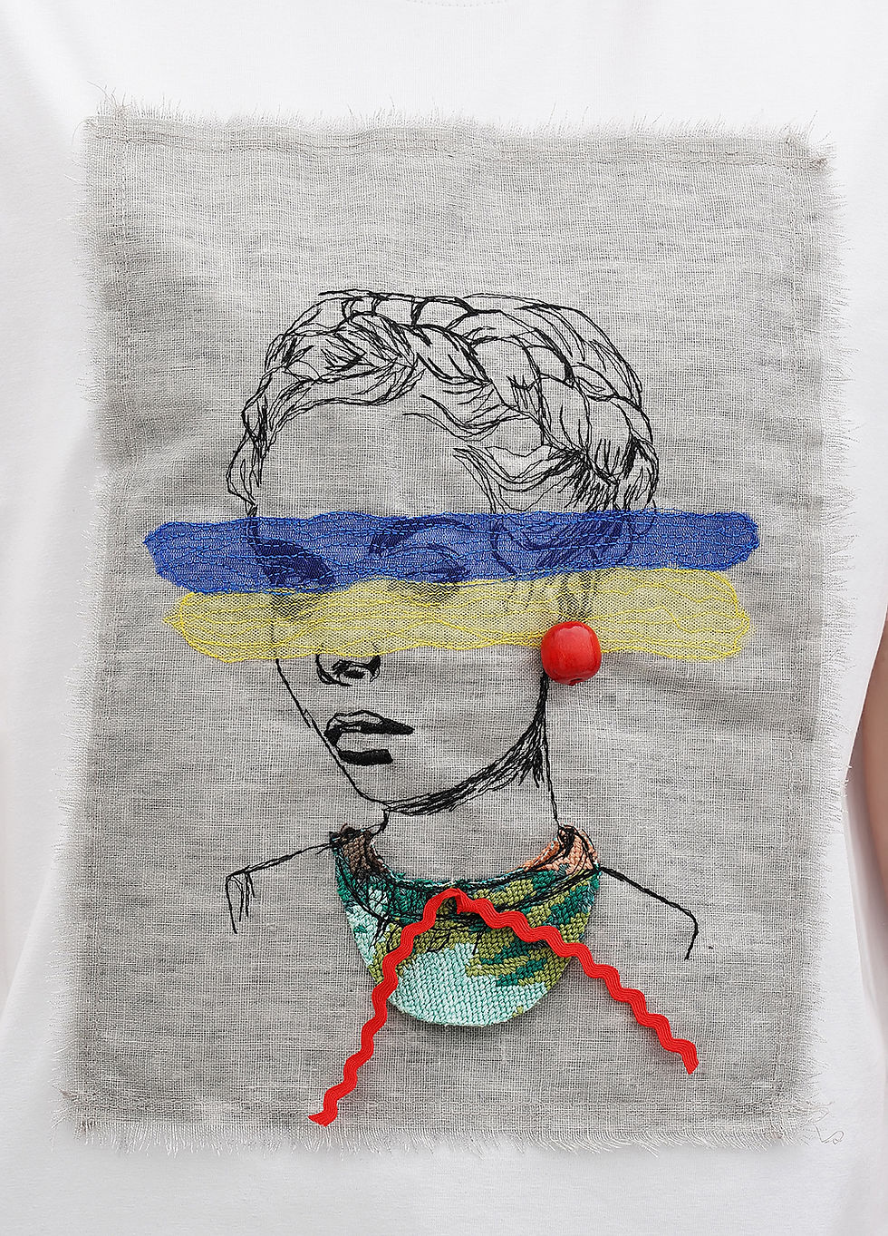 Thumbnail: Female model wearing a designer t-shirt with a vibrant graphic.