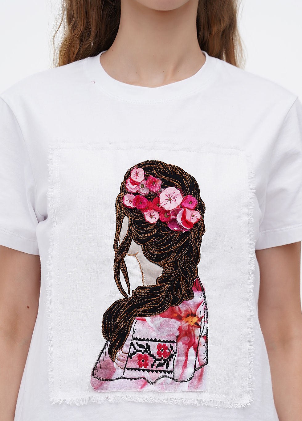 Thumbnail: Female model wearing a designer t-shirt with a vibrant graphic.